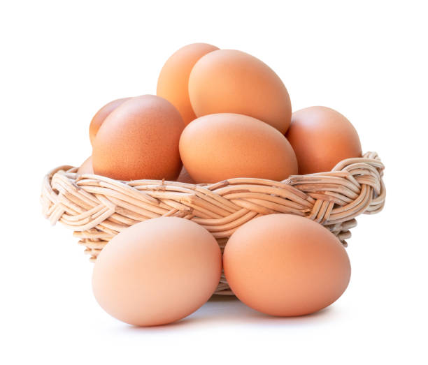 istock Front view of fresh brown chicken eggs in stack in woven bamboo basket isolated on white background with clipping path 2149336202