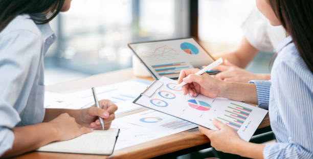 istock diverse coworkers working together in boardroom, brainstorming, discussing and analyzing and planning business strategy. 2149336992