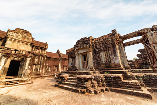View of ancient temple complex Angkor Wat in Siem Reap, Cambodia. Angkor Wat is a popular tourist attraction.