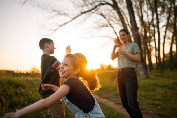 istock Happy family playing with soap bubbles 2149341258