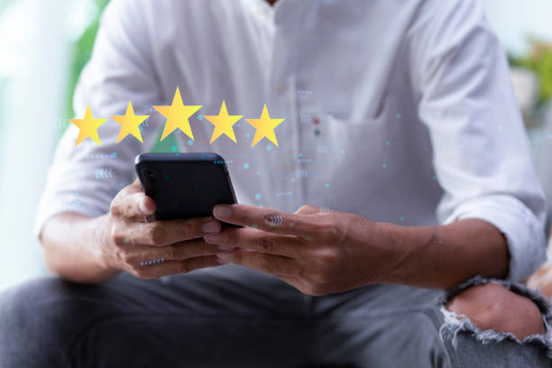 istock feedback review satisfaction service and five star with smart phone 2149342597
