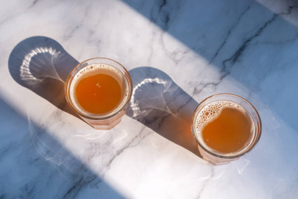 homemade Kombucha in glass on the marble table.