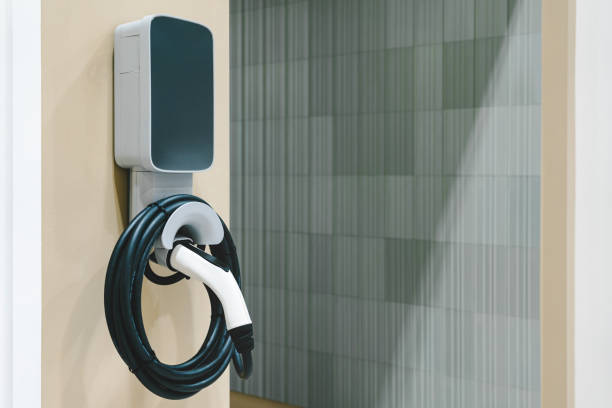 istock EV charger. Clean energy. Charging point at car parking lot. Future transport technology. 2149347135