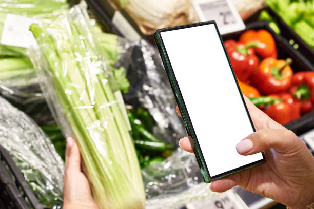 istock Celery vegetable in hand and smartphone 2149348227