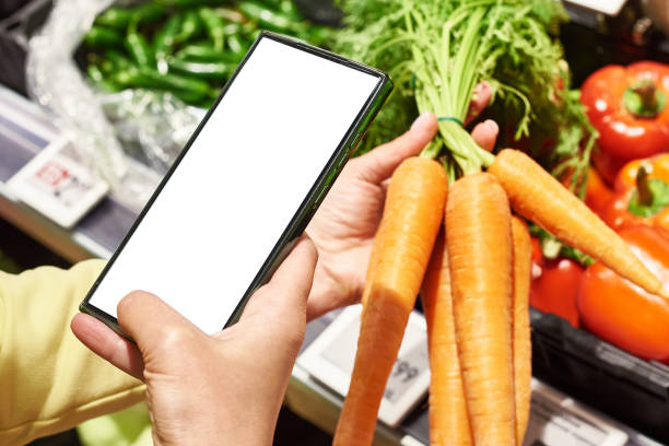 istock Carrot vegetable in hand and smartphone 2149348231