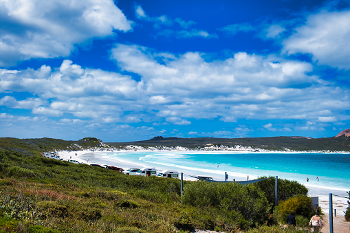 The white sand beach at Lucky Bay in Cape Le Grand National Park, Western Australia, with cars and motor homes parked on the beach