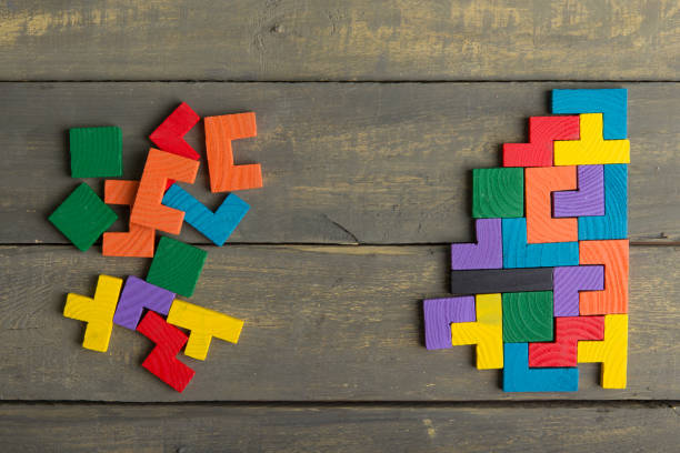 istock Creative solution for idea - business concept, jigsaw puzzle on the wooden desk 2149349848
