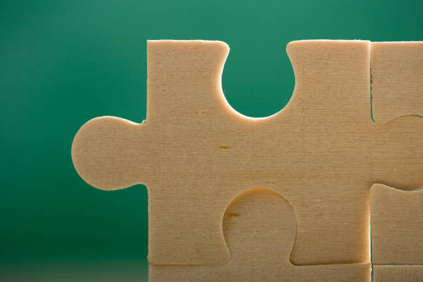 Creative solution for idea - business concept, jigsaw puzzle on the green blackboard background