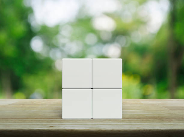 istock Four white block cubes on wooden table 2149350339