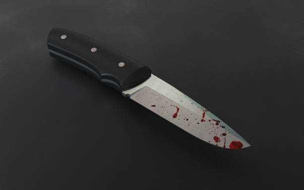 istock Bloody knife lies on the dark background. 2149350954