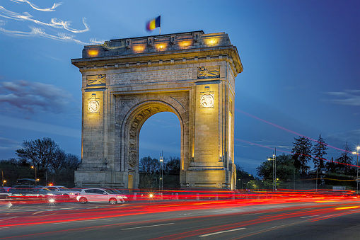The Triumphal Arch monument during the rush hour. Photo taken on 4th of April 2024 in Bucharest, Romania.