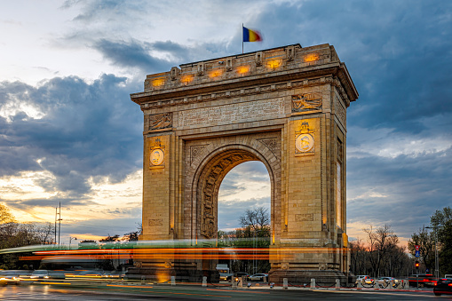 The Triumphal Arch monument during the rush hour. Photo taken on 4th of April 2024 in Bucharest, Romania.