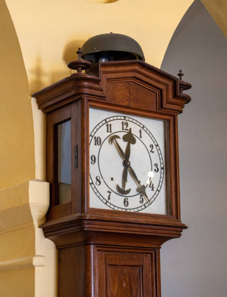 istock brown wood retro floor clock against the wall 2149354751