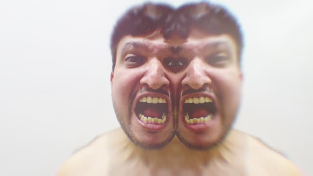 Abstract video of male depicting madness, split personality, possession