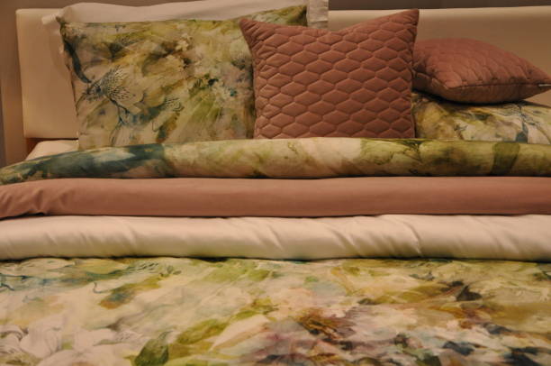 istock Home decor and interior design, bed with white bedding in luxury bedroom, bed linen laundry service and furniture details.The best cushion arrangement in a pastel floral colours and soft pink decor. 2149358293