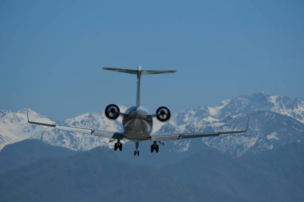 istock Airplane in flight against the backdrop of snow-capped mountains 2149358335