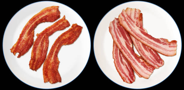 Bunch Of Gourmet Raw And Fried Pork Belly Bacon Rashers On Blue Rimmed White Porcelain Plates Isolated On Black Background High Resolution Stock Photo