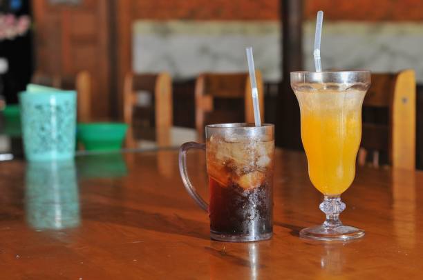 istock iced tea and orange juice on table 2149362298