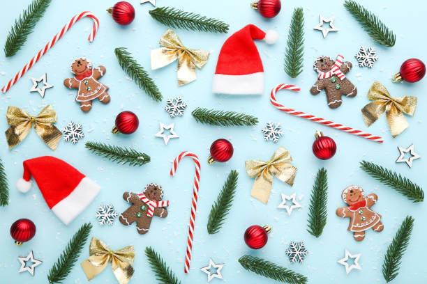 istock Christmas composition. Fir tree branches with ornaments and cookies on blue background 2149362346