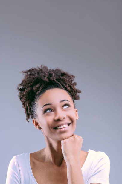 istock Indicates thought, confident Black woman in white 2149362510