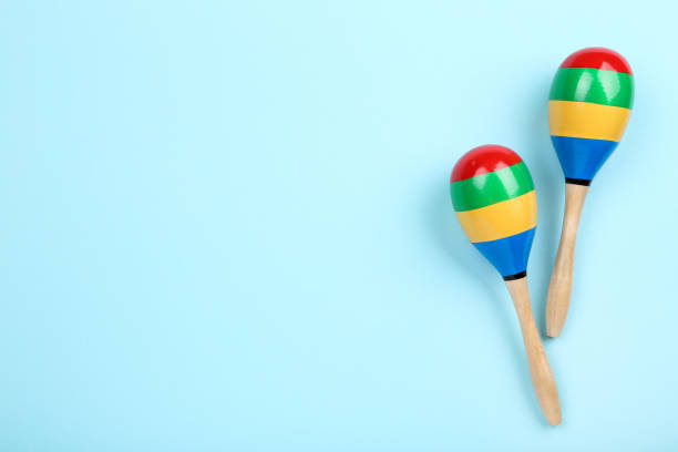 istock Mexican wooden maracas on blue background 2149363920