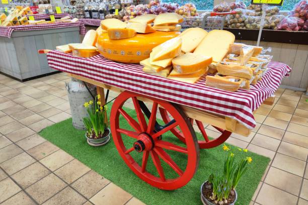 Zevenhuizen, Netherlands - February 2024: Scenic ancient cart with Dutch cheese in a food store.