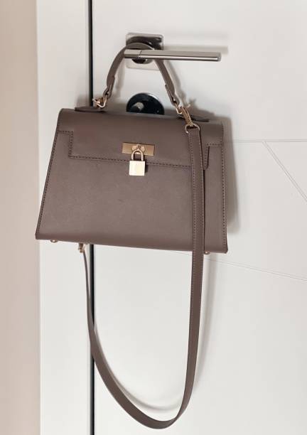 istock Elegant Taupe Designer Handbag on Modern Hook 2149364787