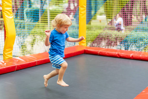 istock Toddler Jumping on Outdoor Trampoline 2149365447