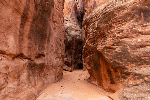 Narrow Sandstone Desert Rock Canyon with Steep Walls in Fiery Furnace Hiking Trail, Arches National Park, Utah, United States