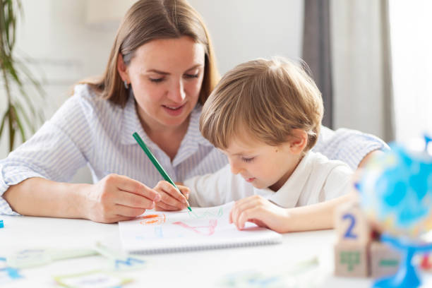 istock Mother Teaching Child Drawing at Home 2149365591