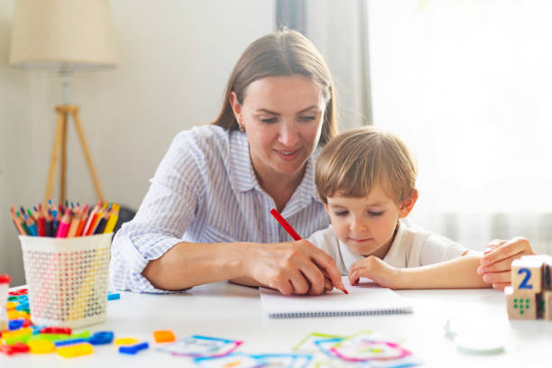 istock Mother Teaching Child Drawing at Home 2149365593