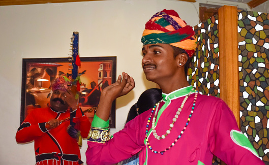 Rajasthanis with traditional dress performing for tourist attraction in Jaipur, India.
