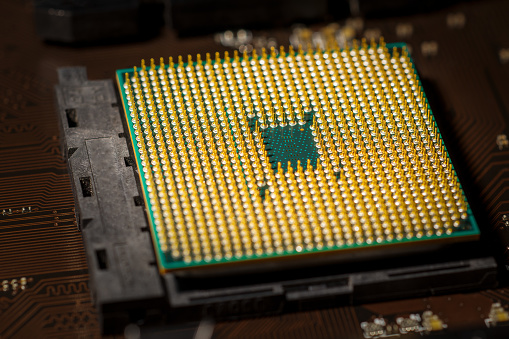 Bottom view of the computer processor with gold plated pins.