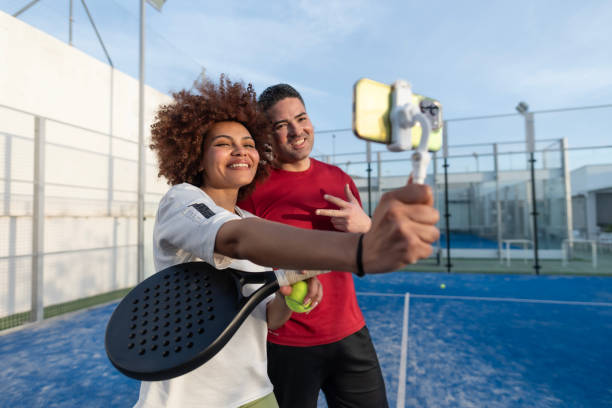 istock Paddle tennis couple taking self portrait after playing match 2149368168