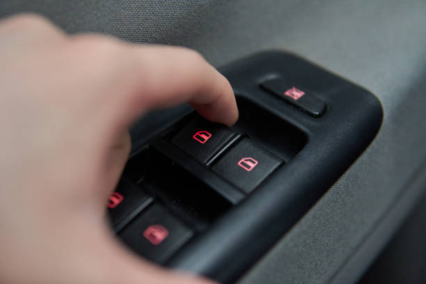 istock Car windows controls and adjustments interior details of door handle 2149370437