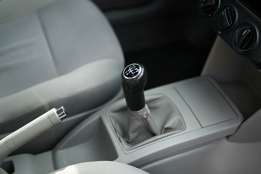 Manual gearbox transmission gear shifter knob handle stick shift in the car interior