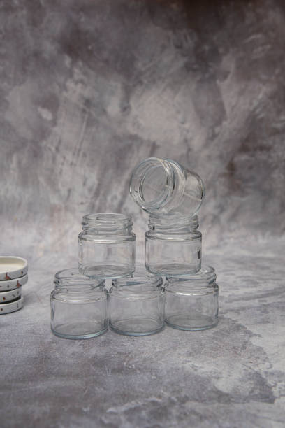 istock Empty small glass jars for sauce, jam on gray background 2149370659