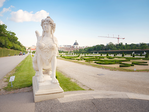 Wien, Austria - July 28, 2023: park near upper Belvedere, with statues and landscaping elements in sunny day