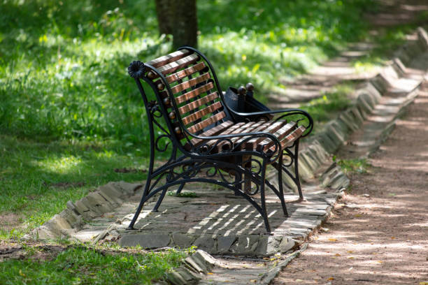 istock Bench in the park in summer 2149371448