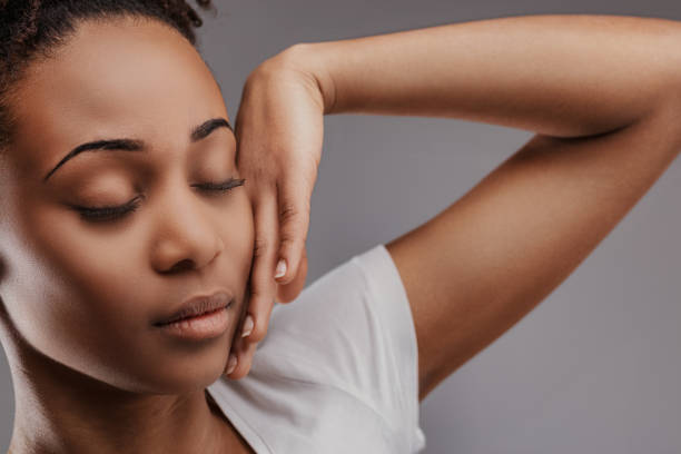 istock Gentle facial touch, closed eyes, serene mood 2149371763