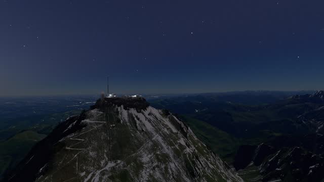 Night aerial view with the stars of Pic du Midi de Bigorre Observatory in French Pyrenees. France