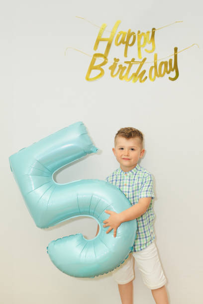 istock Boy with the number five for his birthday 2149374805