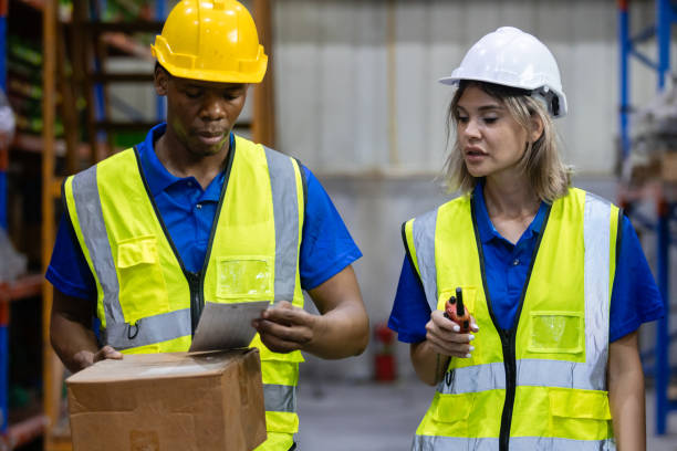 istock Group worker warehouse working brainstorm checklist product to shelf in warehouse store. Logistics factory industry supervisor manufacture. business logistics and transport. 2149376919