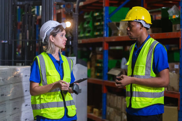 istock Group worker warehouse working brainstorm checklist product to shelf in warehouse store. Logistics factory industry supervisor manufacture. business logistics and transport. 2149377216
