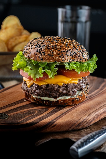 A hamburger or burger is a type of round bread that is sliced ​​in half, and in the middle is filled with a patty which is usually made from meat, then vegetables in the form of lettuce, tomatoes and onions. As a sauce, hamburgers are given various types of sauce such as mayonnaise, ketchup and chili sauce, and mustard. Some hamburger variants are also equipped with cheese and pickles. Hamburgers are a popular fast food in the United States