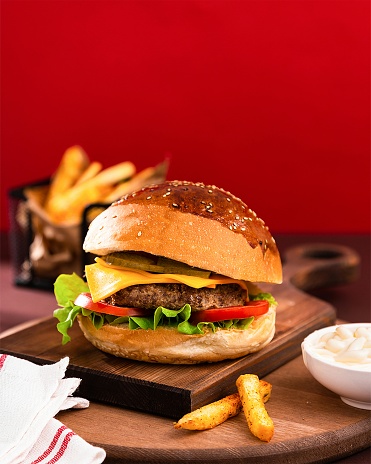 A hamburger or burger is a type of round bread that is sliced ​​in half, and in the middle is filled with a patty which is usually made from meat, then vegetables in the form of lettuce, tomatoes and onions. As a sauce, hamburgers are given various types of sauce such as mayonnaise, ketchup and chili sauce, and mustard. Some hamburger variants are also equipped with cheese and pickles. Hamburgers are a popular fast food in the United States