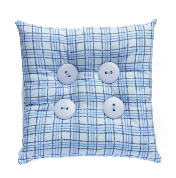 Blue small cushion or pincushion isolated on white background