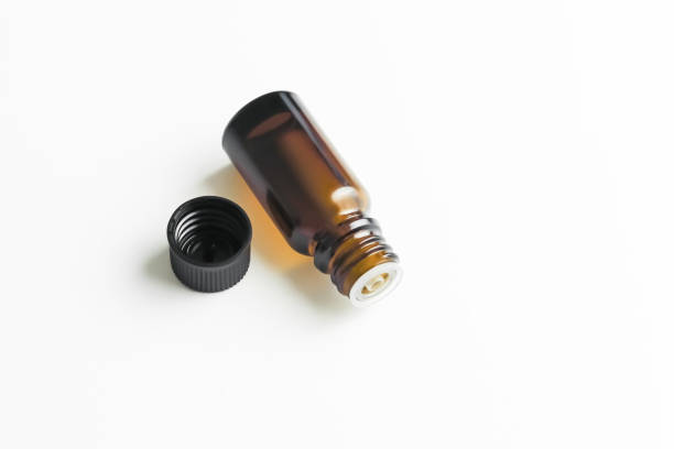 istock yellow glass bottle with essential aromatic oil on a white background 2149379723