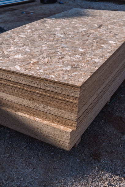 istock The stack of OSB sheets is ready for construction on a pallet, with fragments of compressed sawdust. 2149388249