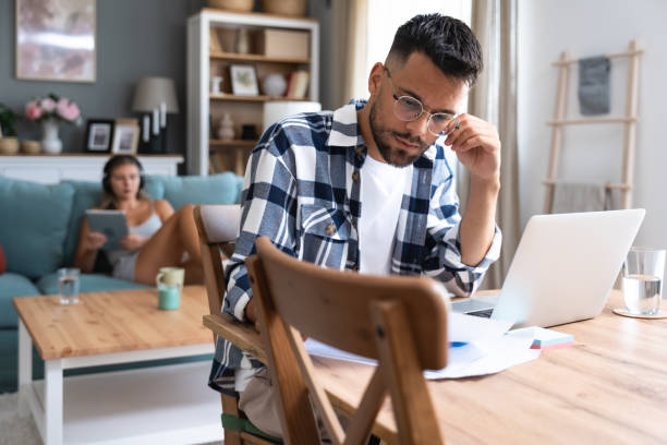 istock Young freelance business finance man has a problem with attention deficit hyperactivity disorder (ADHD) he cant start work on new project Male lost concentration cant work from home on laptop computer 2149389233